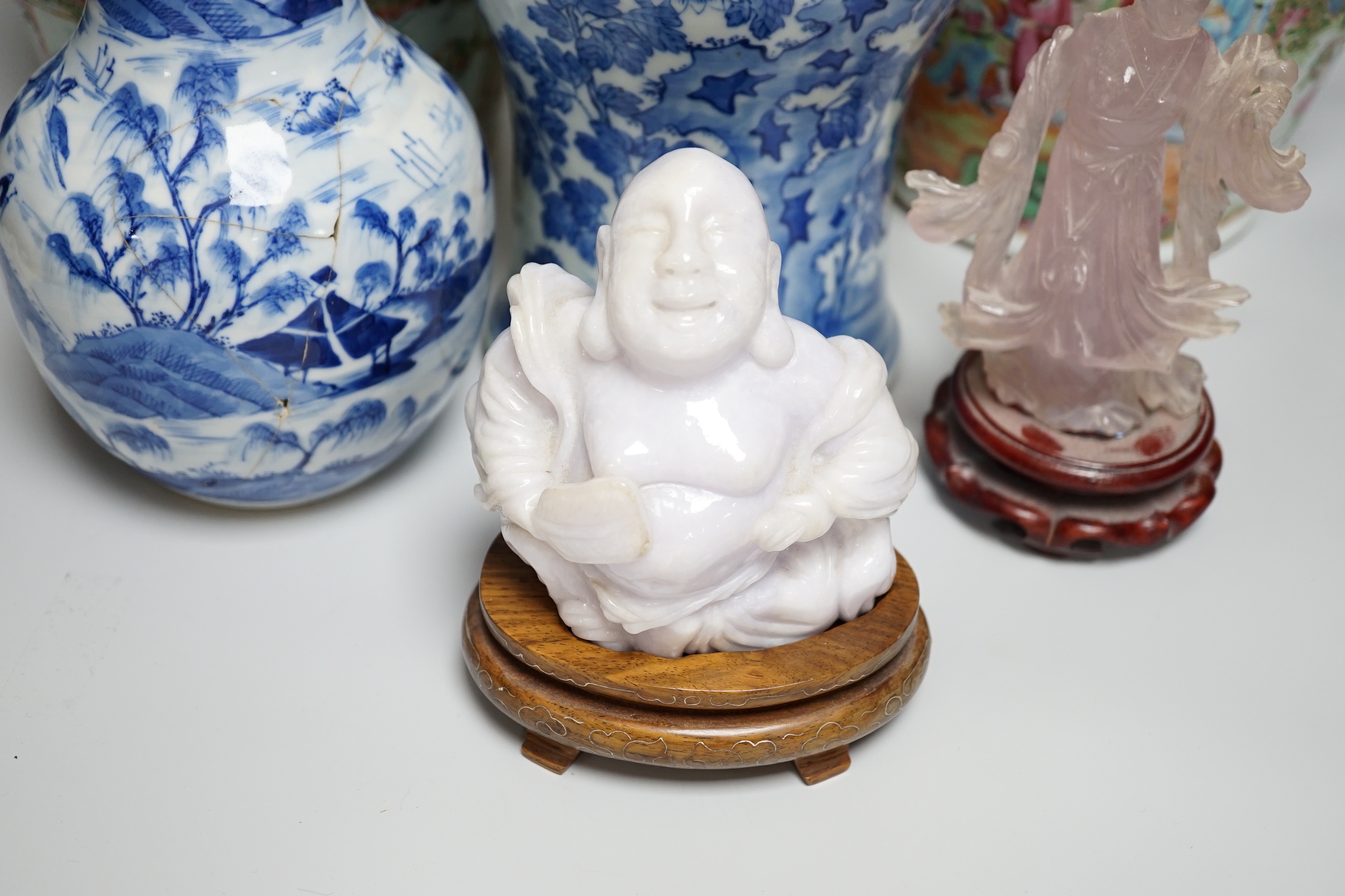 A pair of Chinese Canton decorated famille rose enamelled vases, 36cm high, an early 20th century Chinese blue and white baluster vase, 25cm (a.f.), a 19th century Chinese blue and white gu shaped vase, 37.5cm (a.f.), a